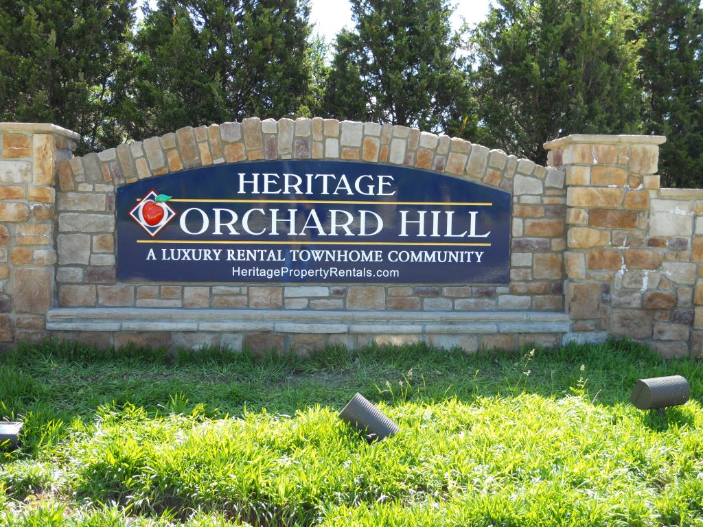 Orchard Hill is carved HDU sign with applied logo plaque