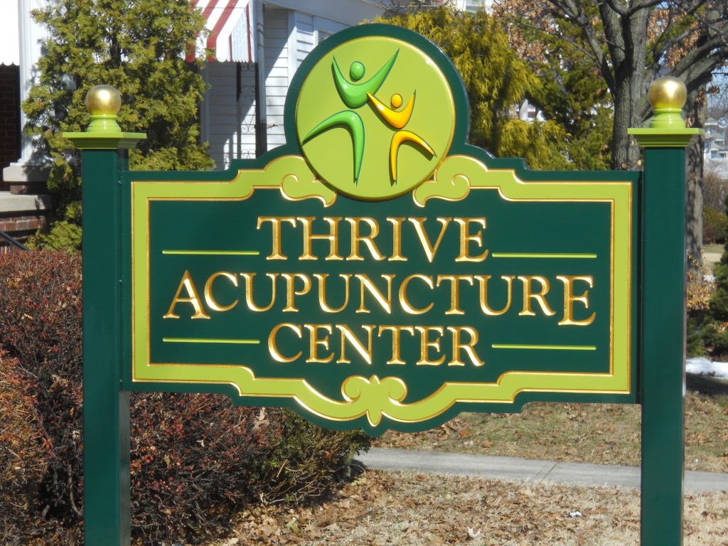 Thrive Acupuncture is a carved 23kt gold leaf sign with cut out logo & back panel applied to sign (SEE WORK IN PROGRESS)